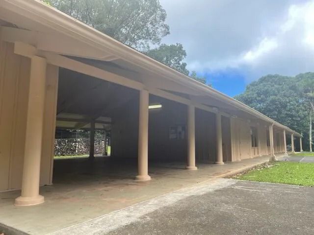 The same colonnade with its posts and fascia painted warm cream