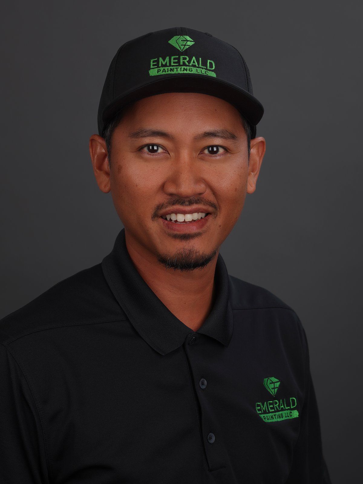 Casey Kimura in an Emerald Painting cap and black polo