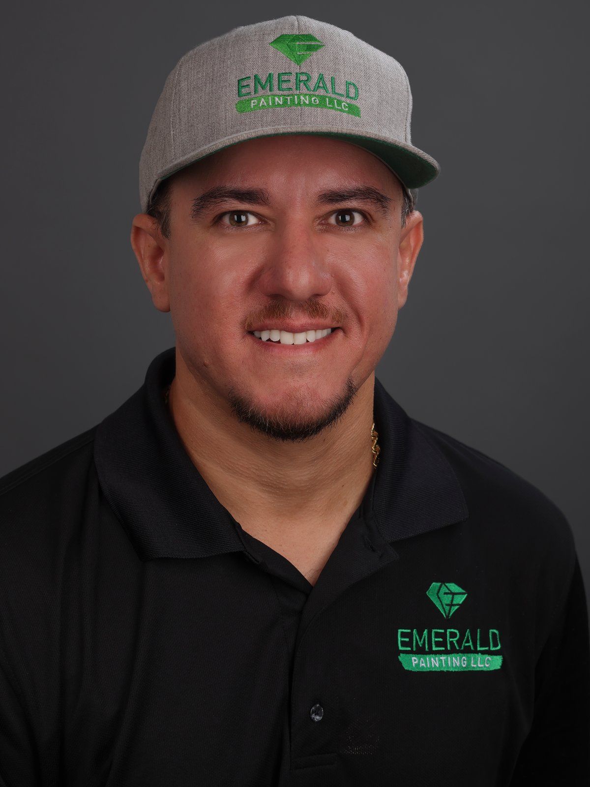 Jonathan Sanchez in an Emerald Painting cap and black polo